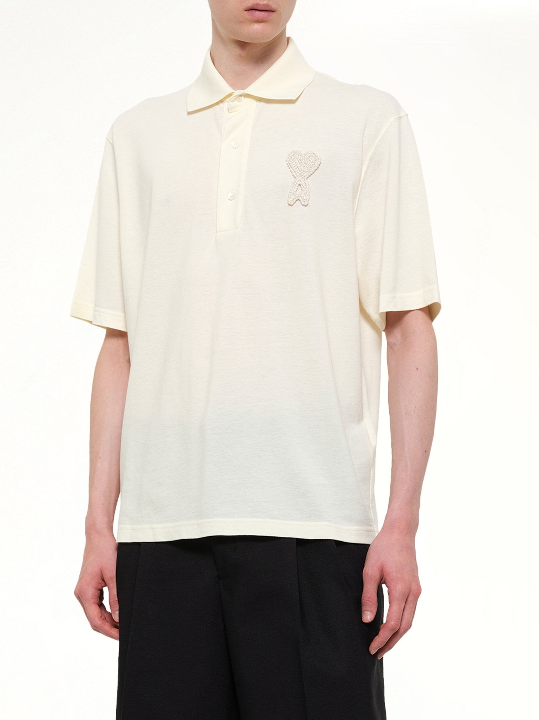 AMI PARIS Knitted ADC Boxy Polo in Off White Detail Shot from MARAIS