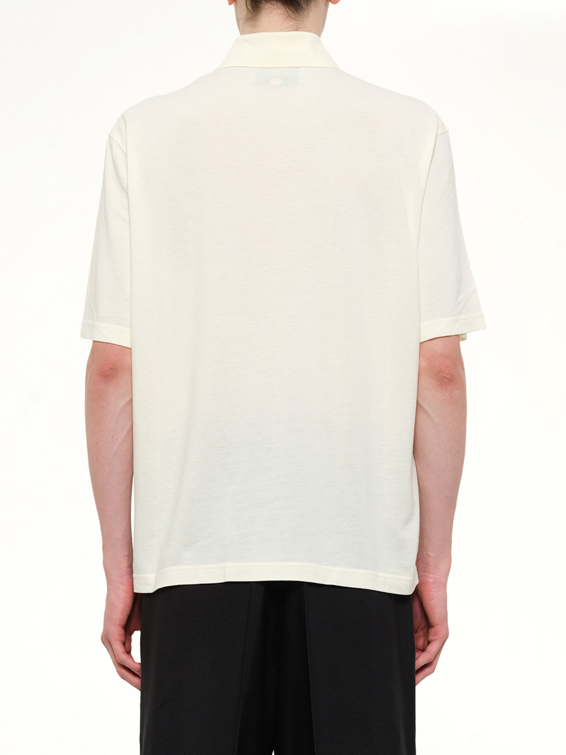 AMI PARIS Knitted ADC Boxy Polo in Off White Back View from MARAIS