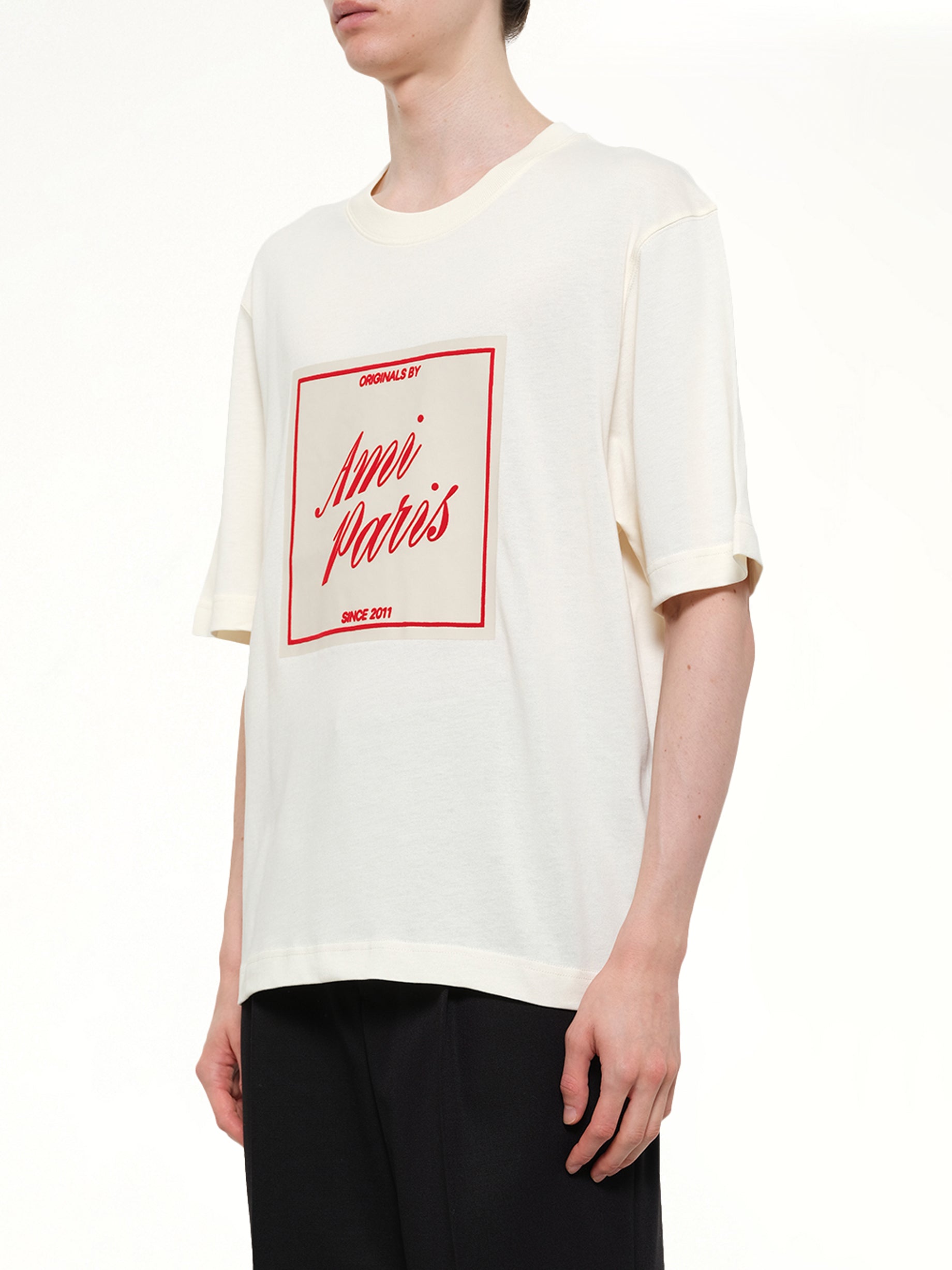AMI PARIS Signature Print Boxy Fit T-Shirt in White Side View from MARAIS