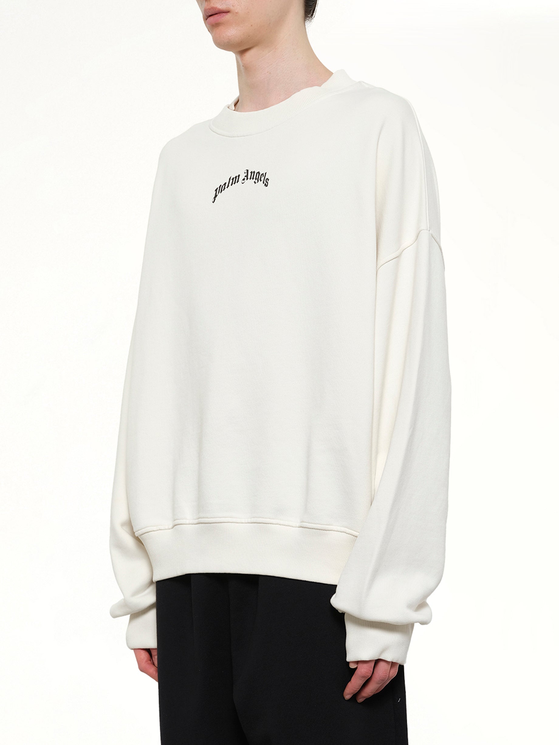 PALM ANGELS Back Curved Logo Loose Sweatshirt in Off White/Black Side View from MARAIS