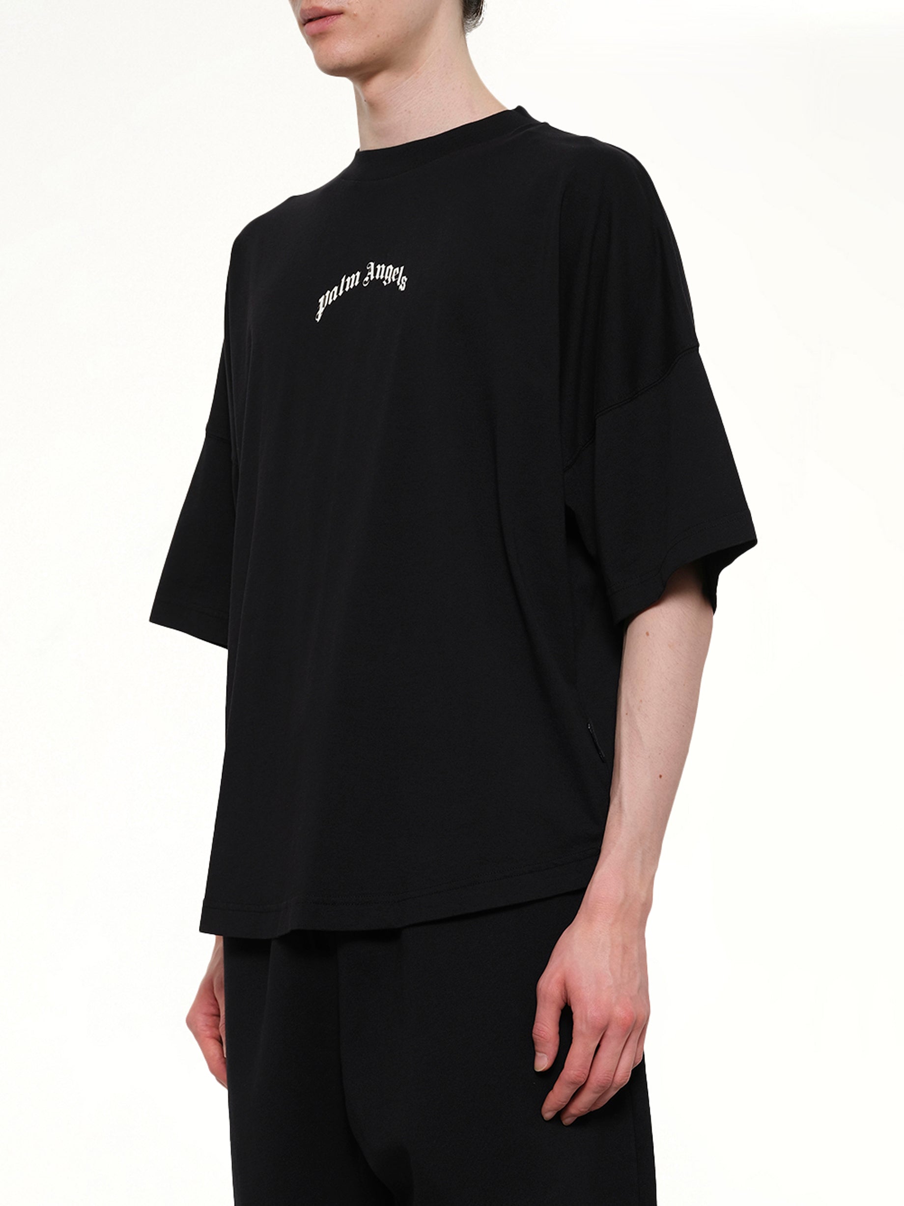 PALM ANGELS Classic Logo Over T-Shirt in Black/Off White Side View from MARAIS
