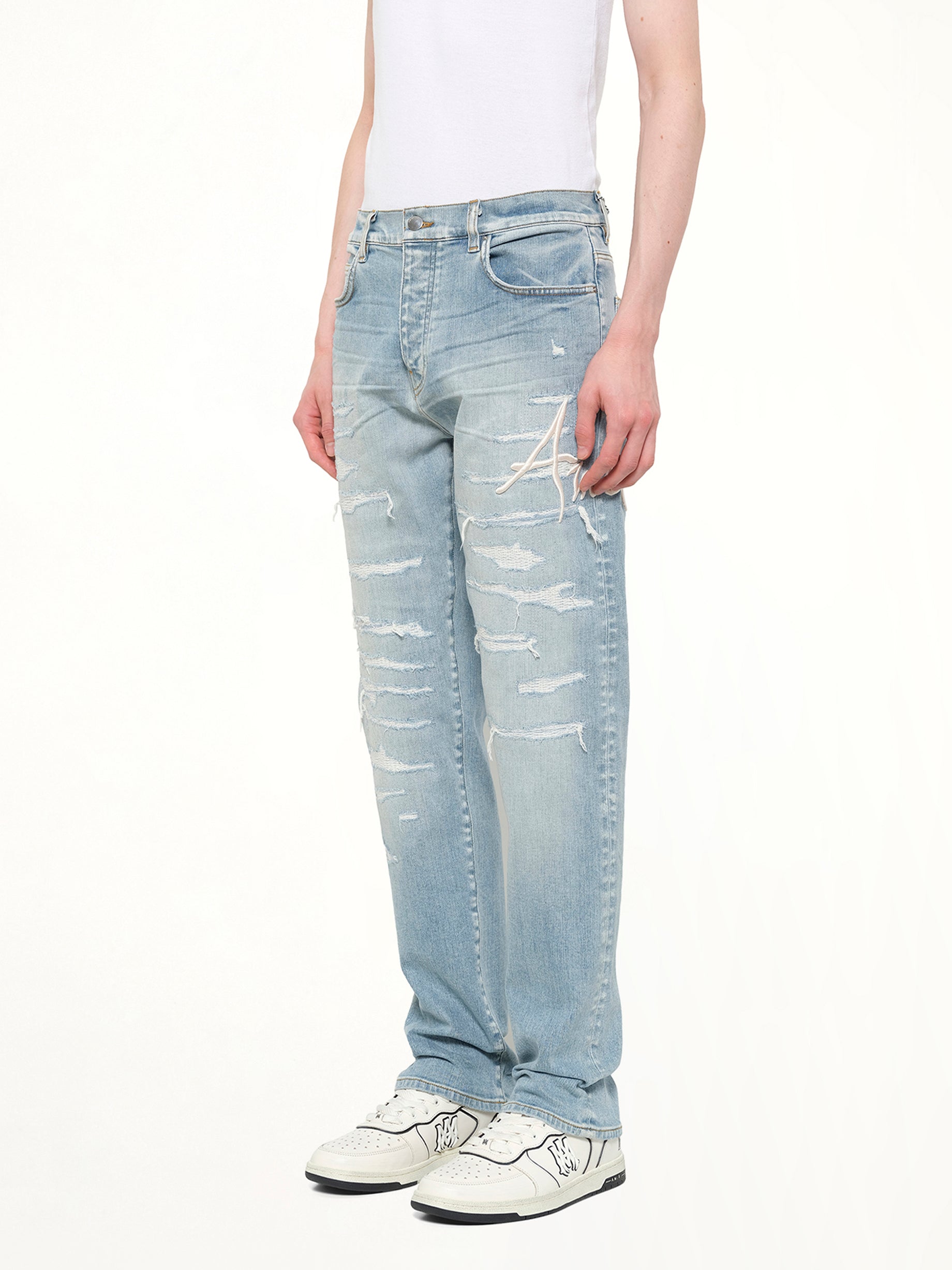 AMIRI Amiri Repaired Slim Jean in Worn Slate Side View from MARAIS