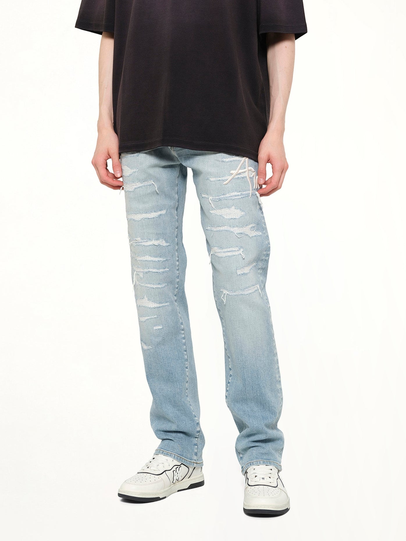 AMIRI Amiri Repaired Slim Jean in Worn Slate Detail Shot from MARAIS