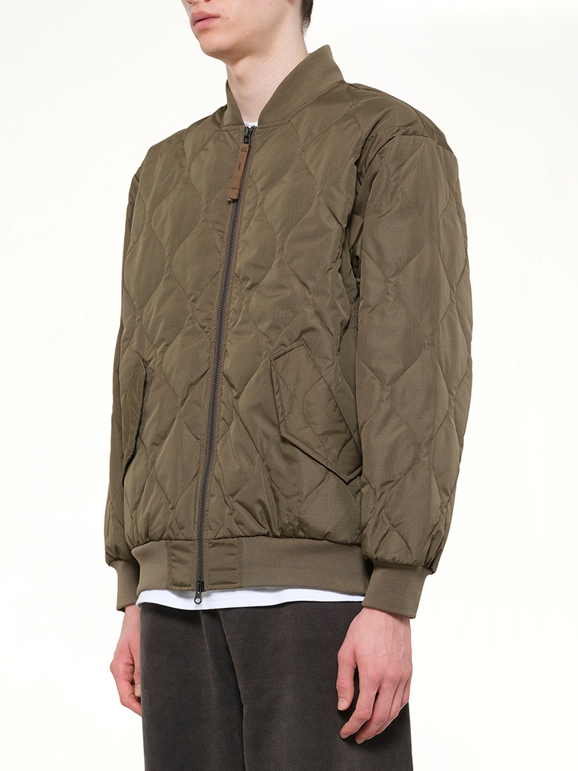 TAION Military MA-1 Type Down Jacket in Dark Olive Side View from MARAIS