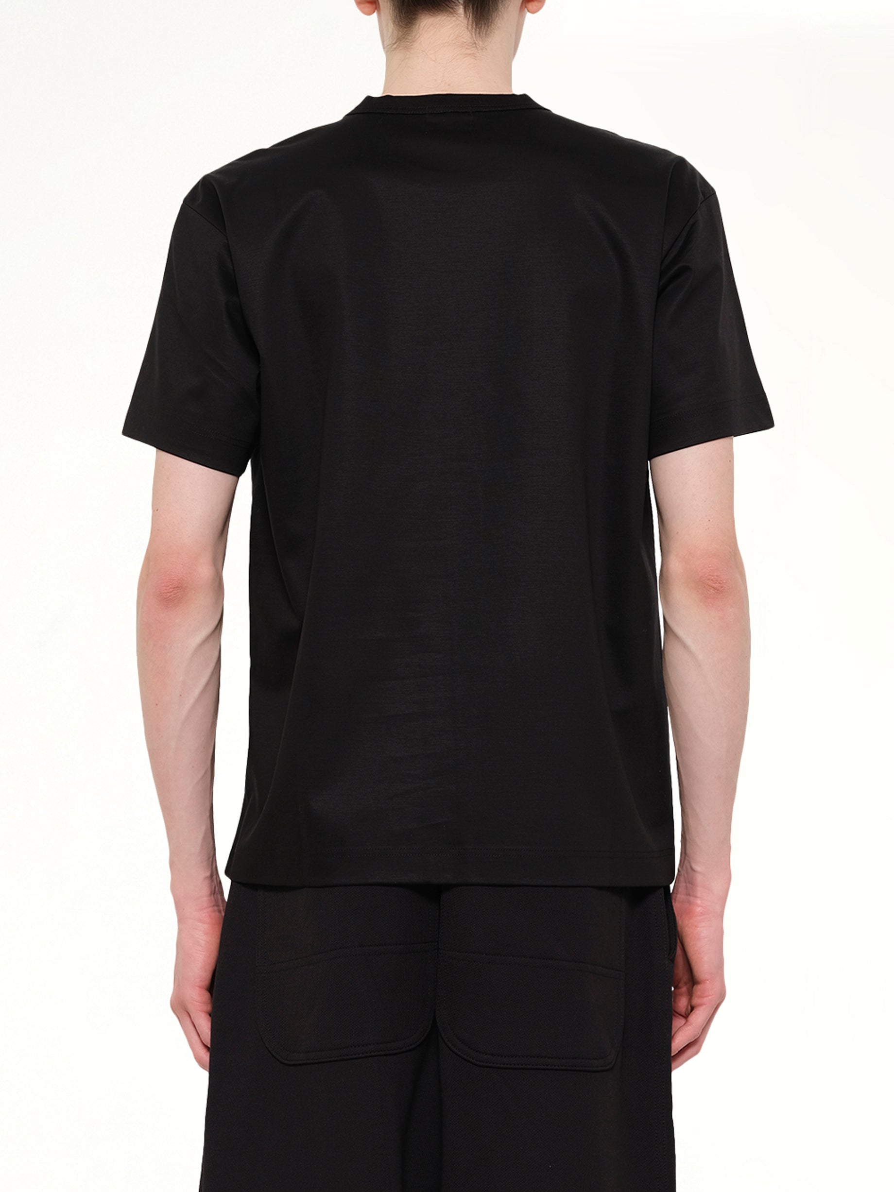 DOVER STREET MARKET D.S.M.U' T-Shirt in Black Back View from MARAIS