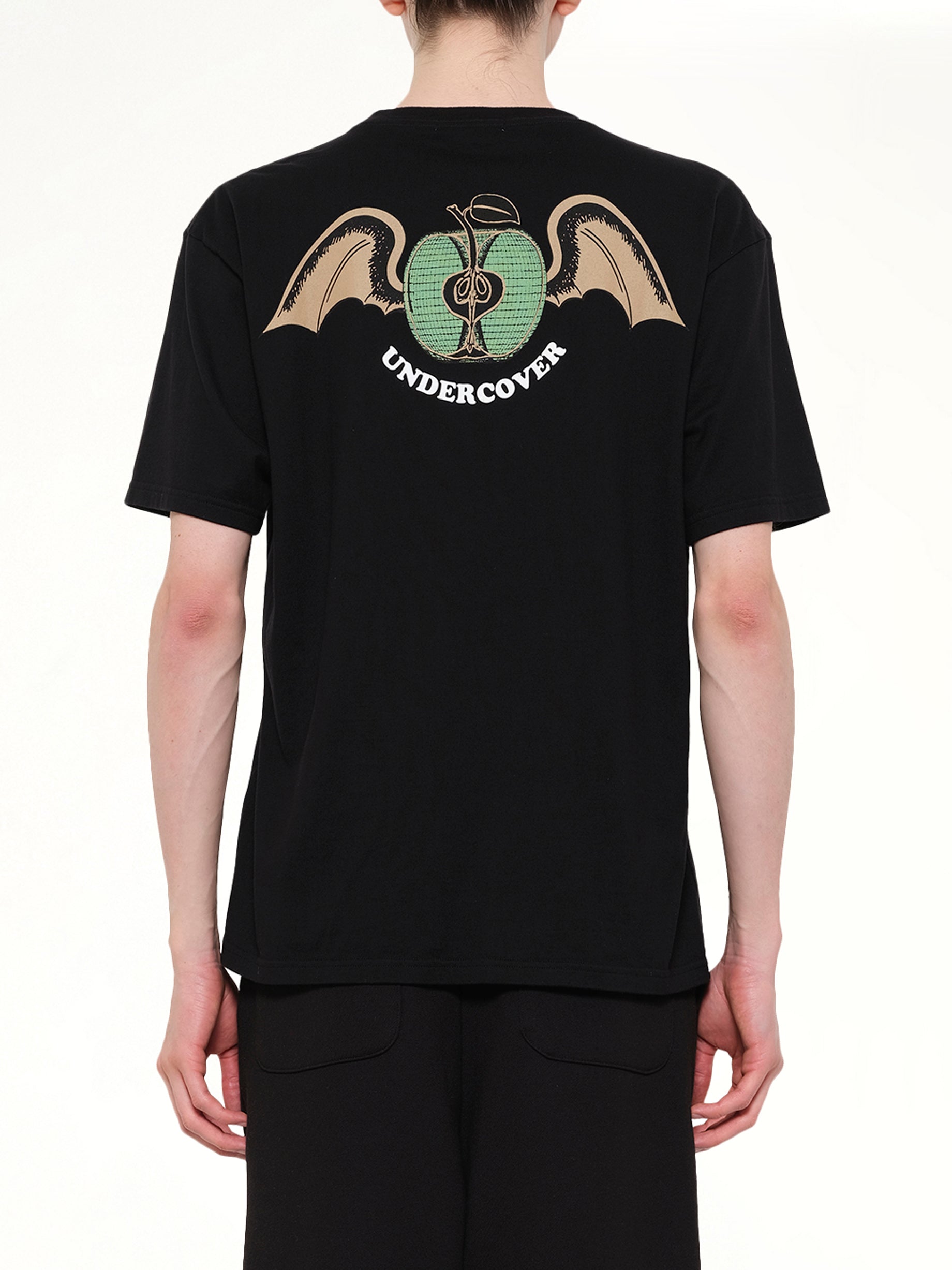 UNDERCOVER Apple Wings T-Shirt in Black Back View from MARAIS