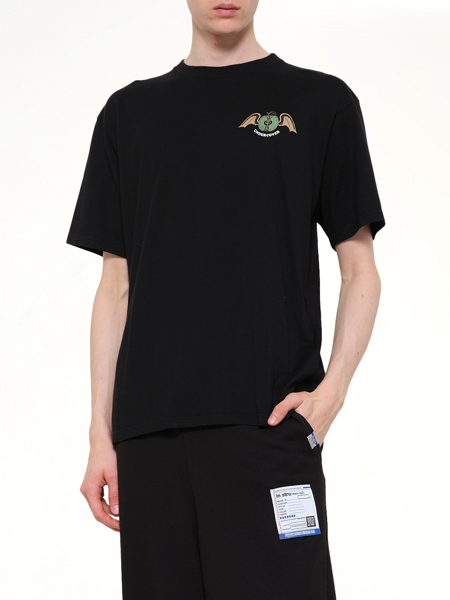 UNDERCOVER Apple Wings T-Shirt in Black Detail Shot from MARAIS