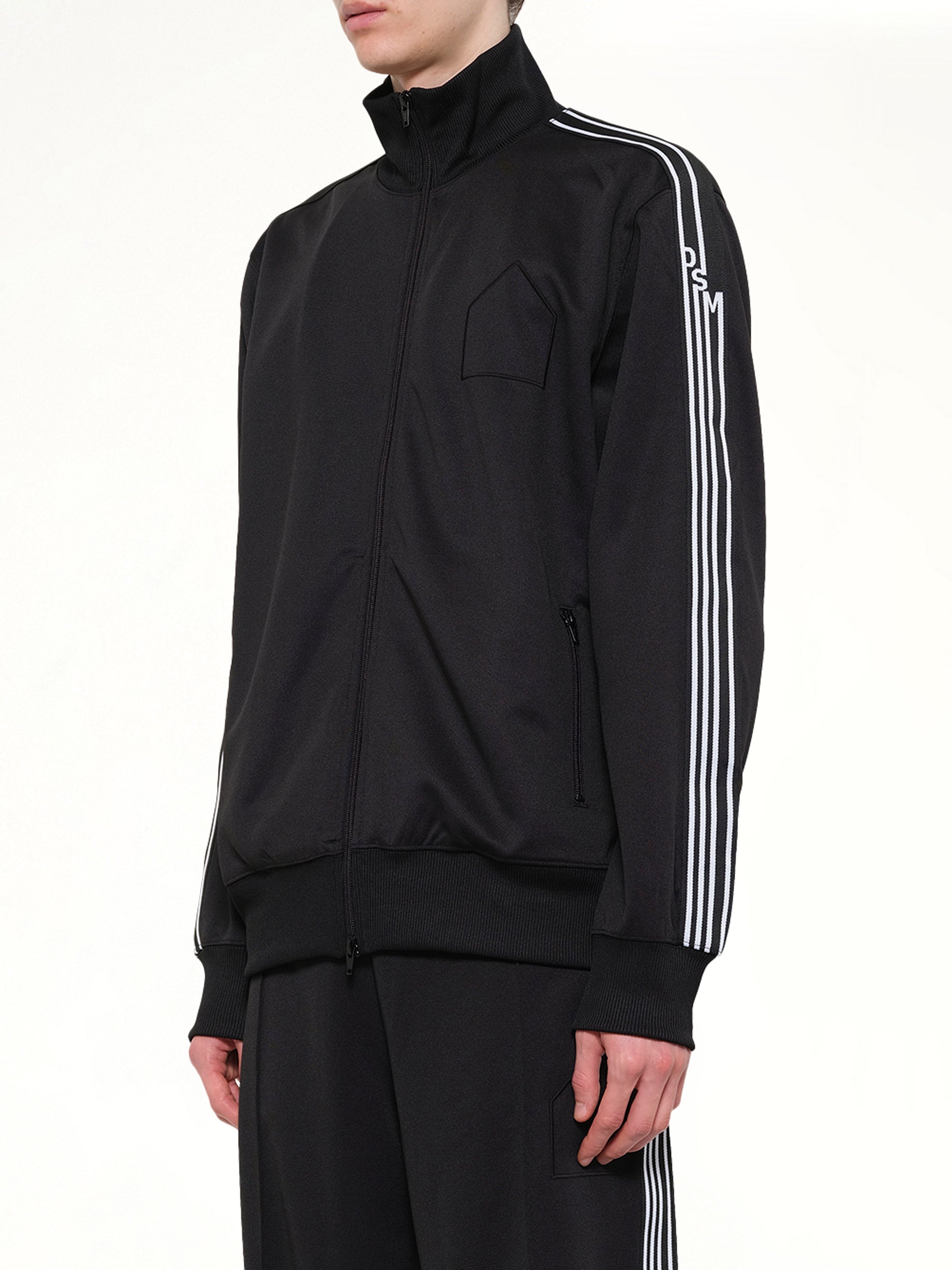 DOVER STREET MARKET Tracksuit Jacket in Black Side View from MARAIS