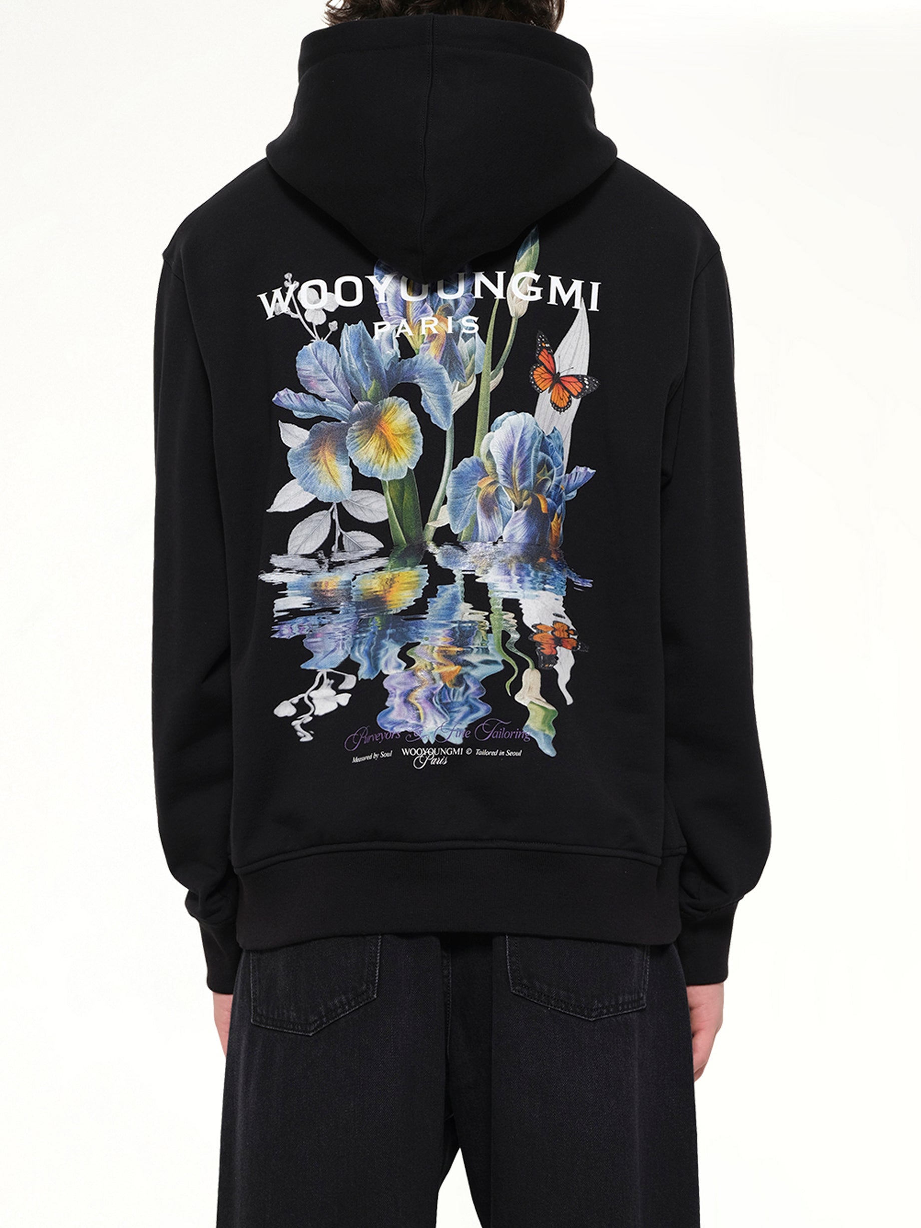 WOOYOUNGMI Flower Back Print Hoodie in Black Back View from MARAIS