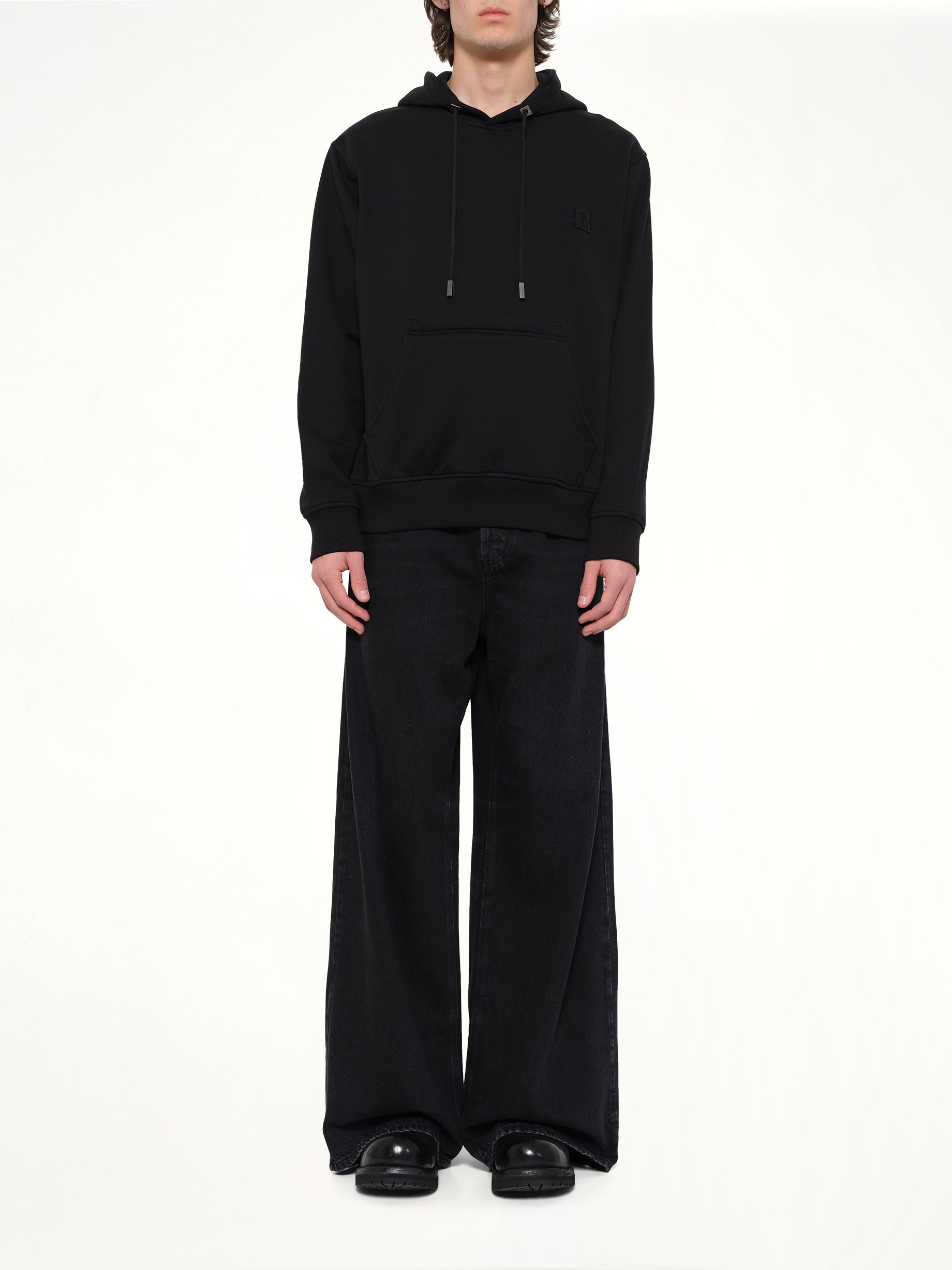 WOOYOUNGMI Flower Back Print Hoodie in Black Model View from MARAIS