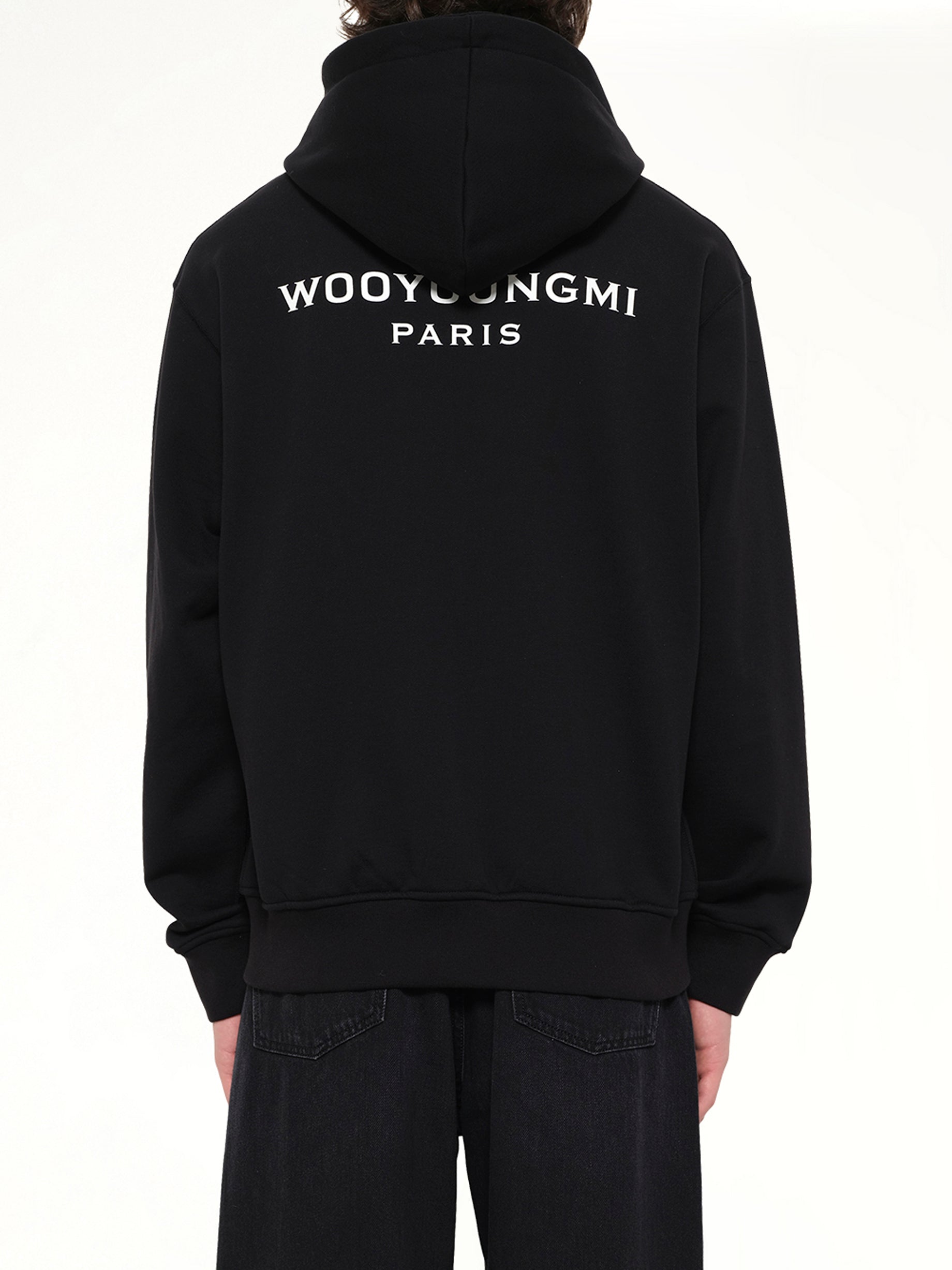WOOYOUNGMI WYM Zip Hoodie in Black Back View from MARAIS