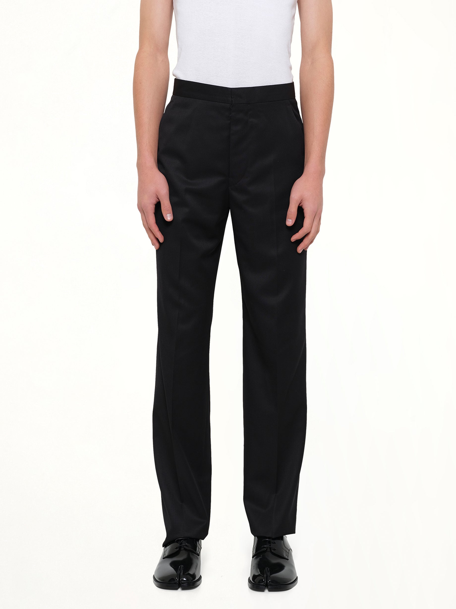 MAISON MARGIELA Compact Light Wool Suit Pants in Black Front View from MARAIS