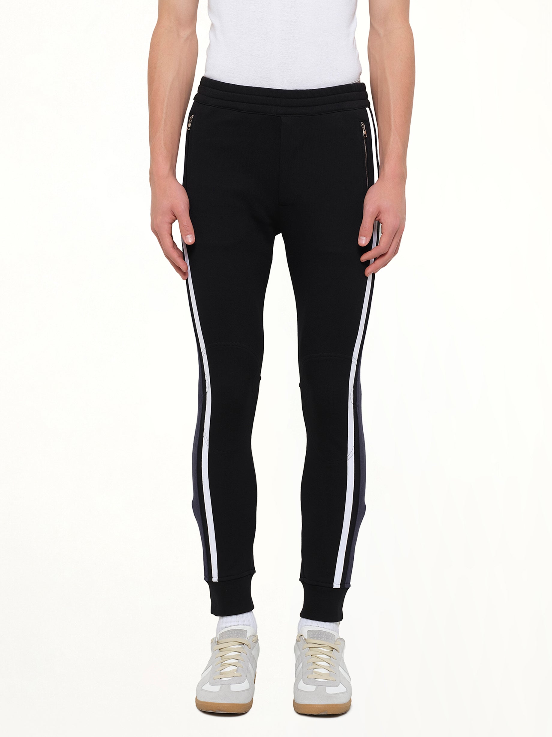 ALEXANDER MCQUEEN Embroidered Sweat Pants in Black Front View from MARAIS