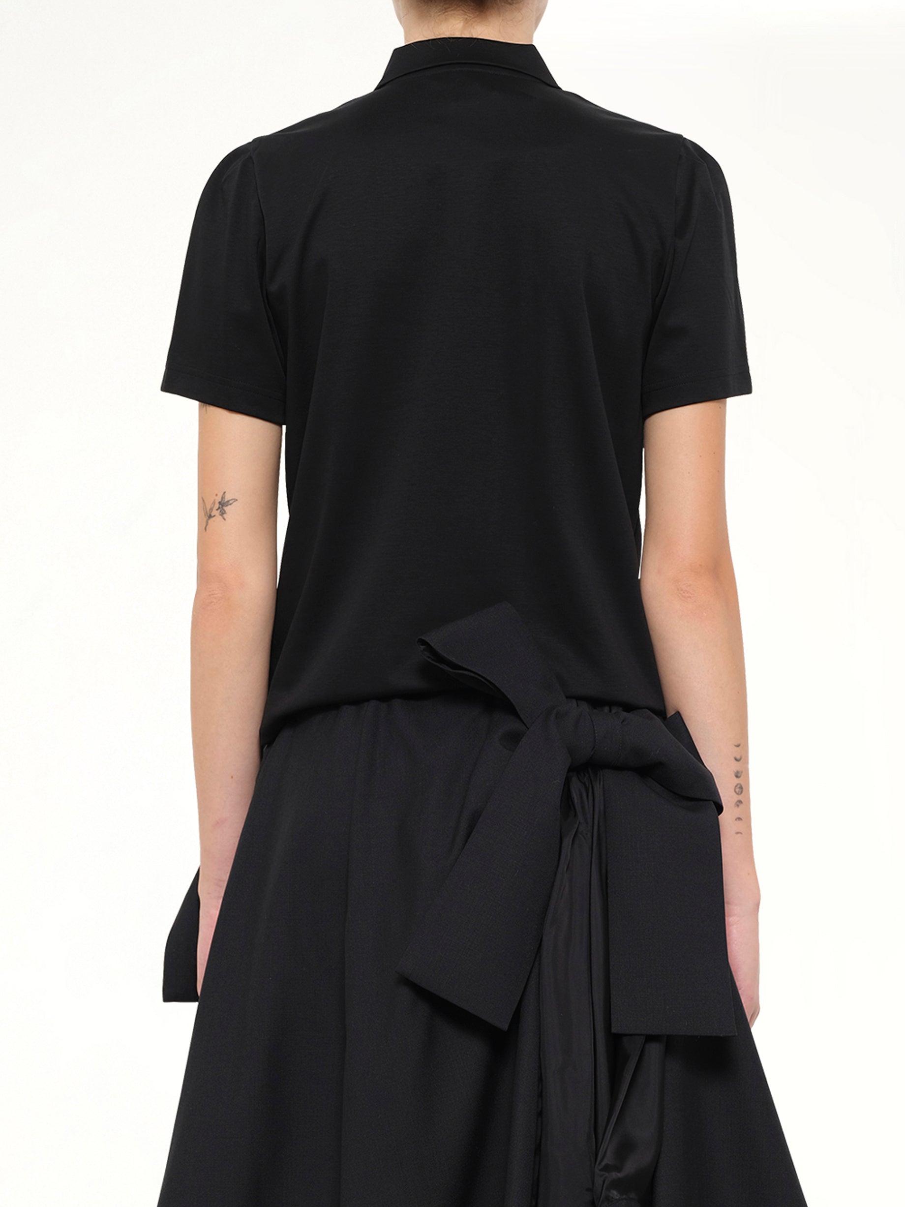 NOIR KEI NINOMIYA Bowtie Polo in Black Back View from MARAIS