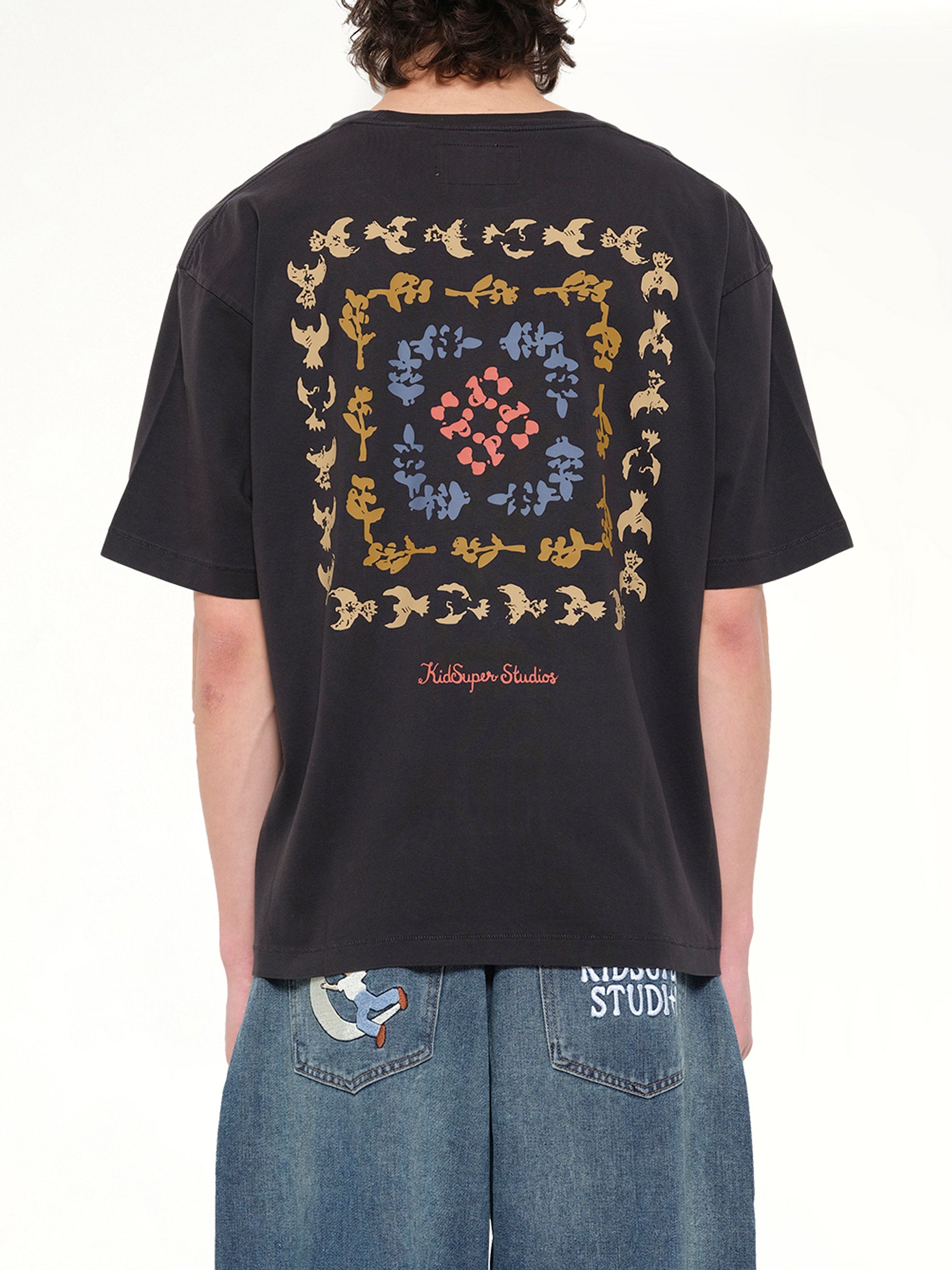 KIDSUPER Dove Pattern T-Shirt in Washed Black Back View from MARAIS