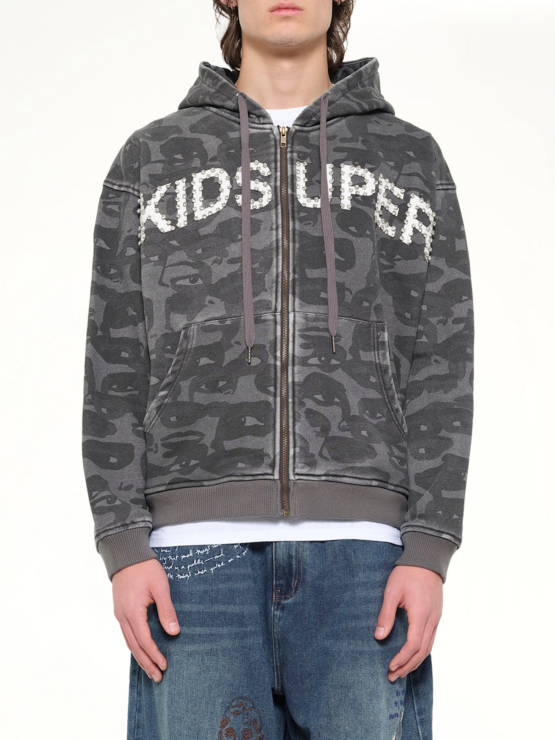 KIDSUPER Face Camo Hoodie in Black Front View from MARAIS