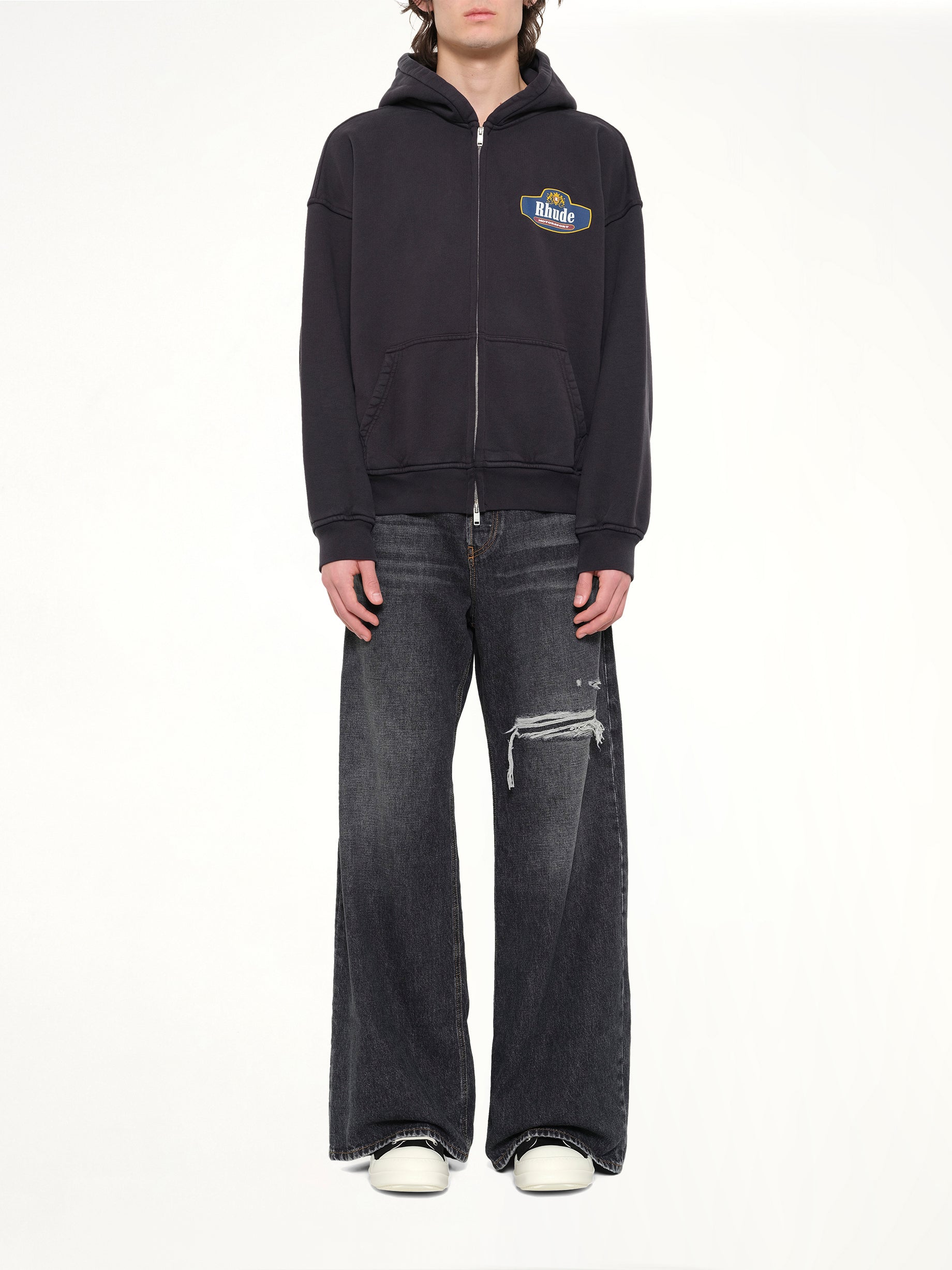 RHUDE Racing Crest Zip-Up Hoodie in Vintage Black Model View from MARAIS