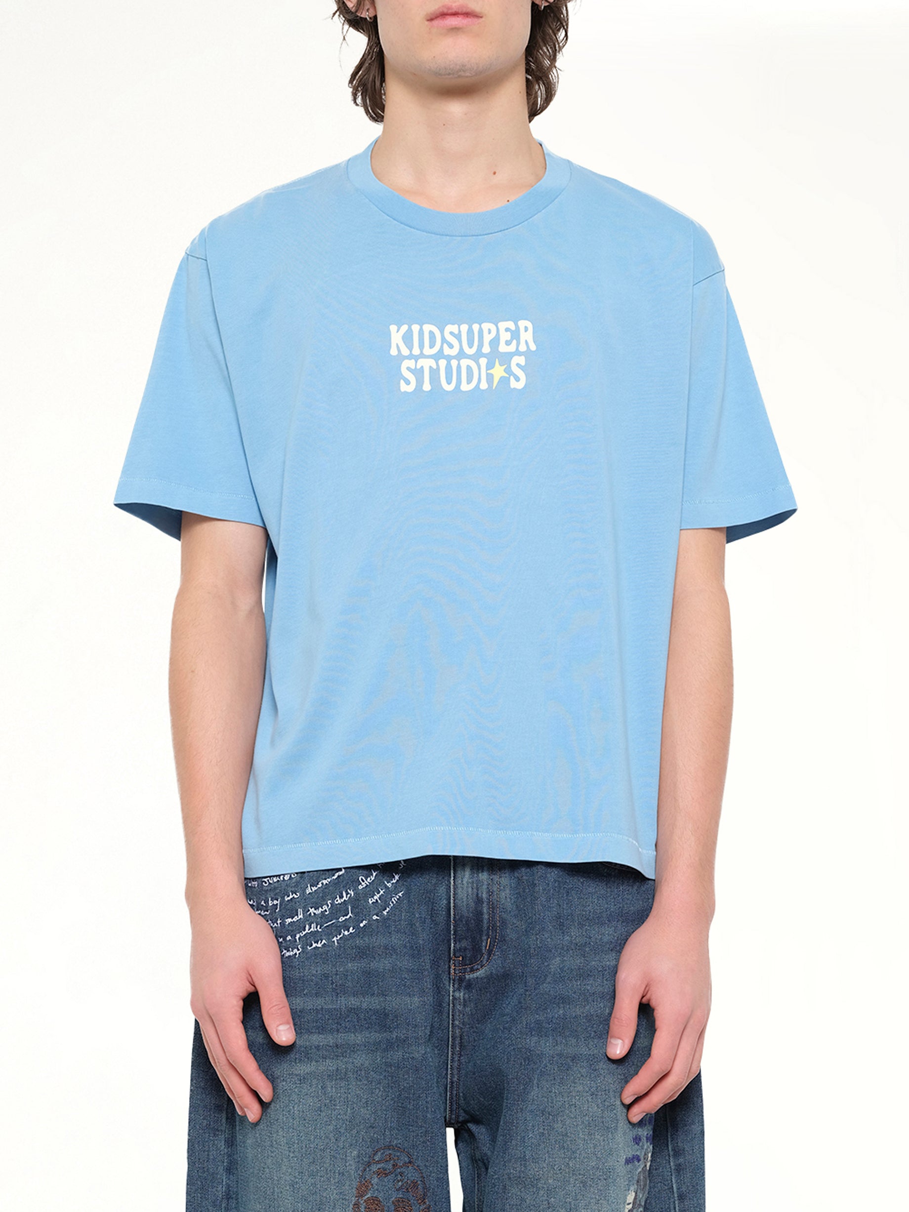 KIDSUPER The Boy who Jumped the Moon T-Shirt in Light Blue Front View from MARAIS