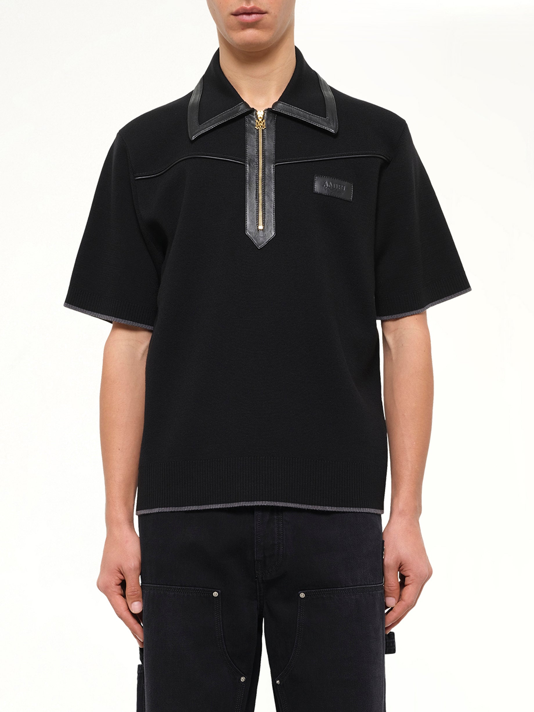 Leather Trim Knit Zipped Polo in Black