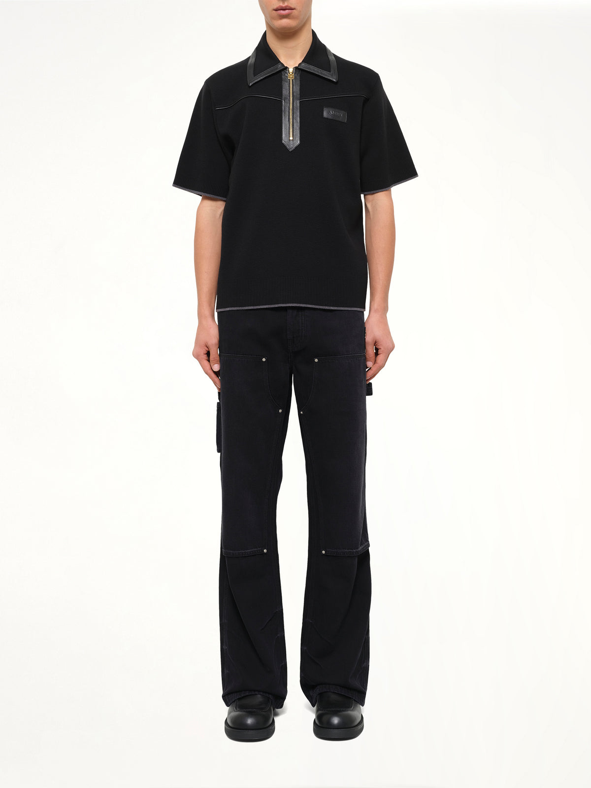 Leather Trim Knit Zipped Polo in Black
