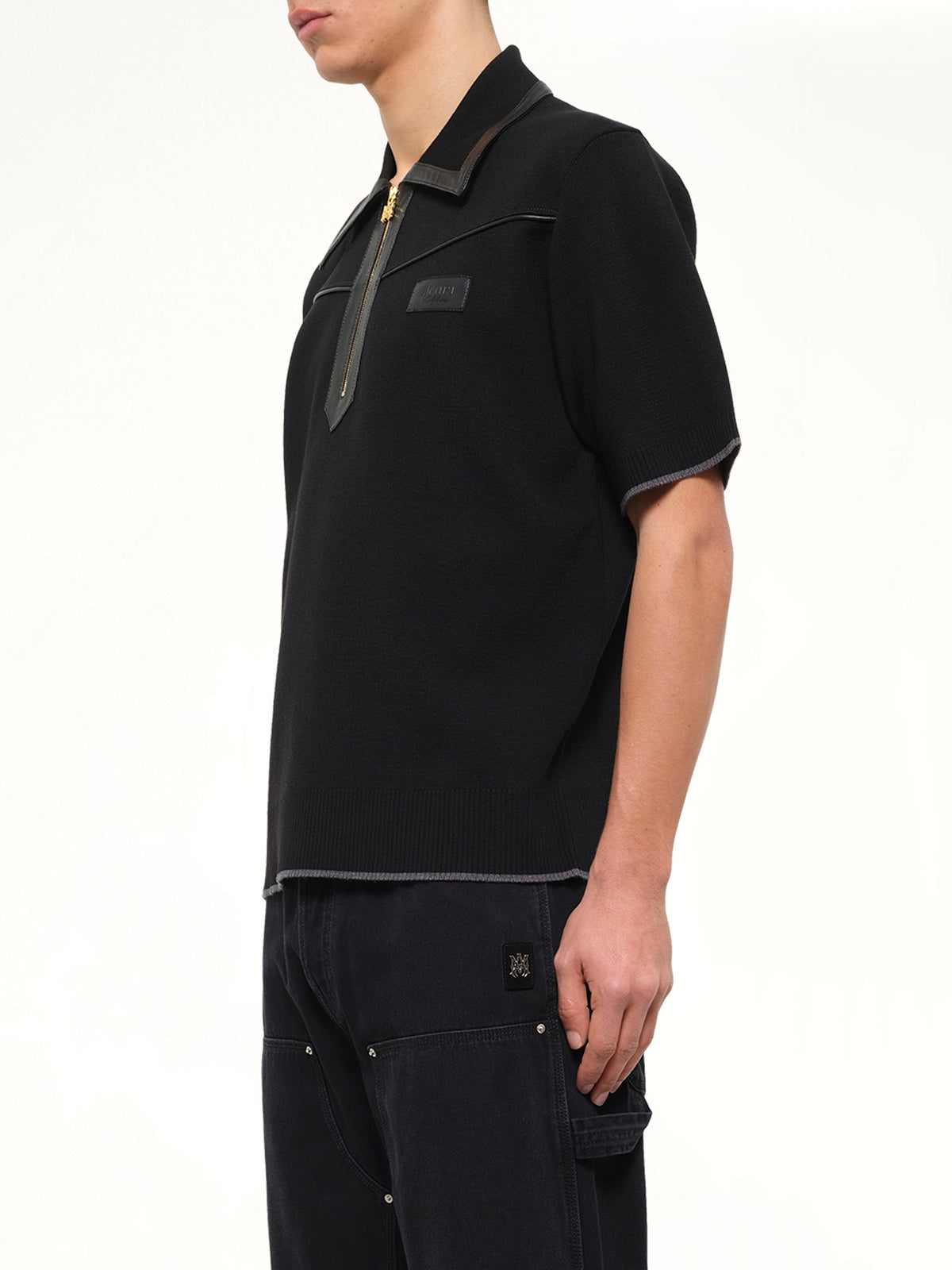 Leather Trim Knit Zipped Polo in Black
