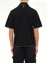 Leather Trim Knit Zipped Polo in Black