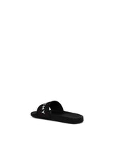 Logo Flat Sandal with Raised Logo in Black Back View | GIVENCHY