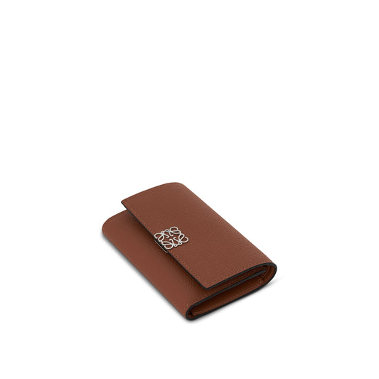 Anagram Small Vertical Wallet in Pebble Grain Calfskin in Tan